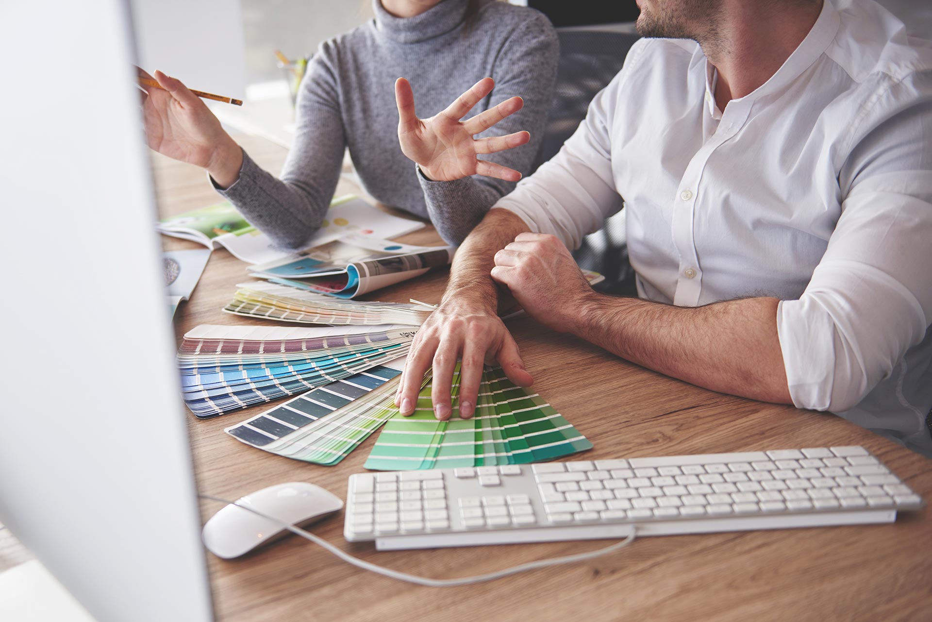 Two Coworkers Choosing Best Option Colour